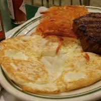 New York Steak and Egg · With grilled potatoes, toast, butter and jelly.