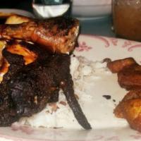 Jerk Chicken · Smoked and grilled, sweet plantains, rice, and peas.
