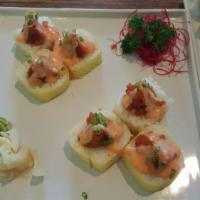 Yellow Submarine Roll · Inside stuffed with shrimp tempura, crab, and avocado. Outside soy wrapped, spicy tuna, and ...
