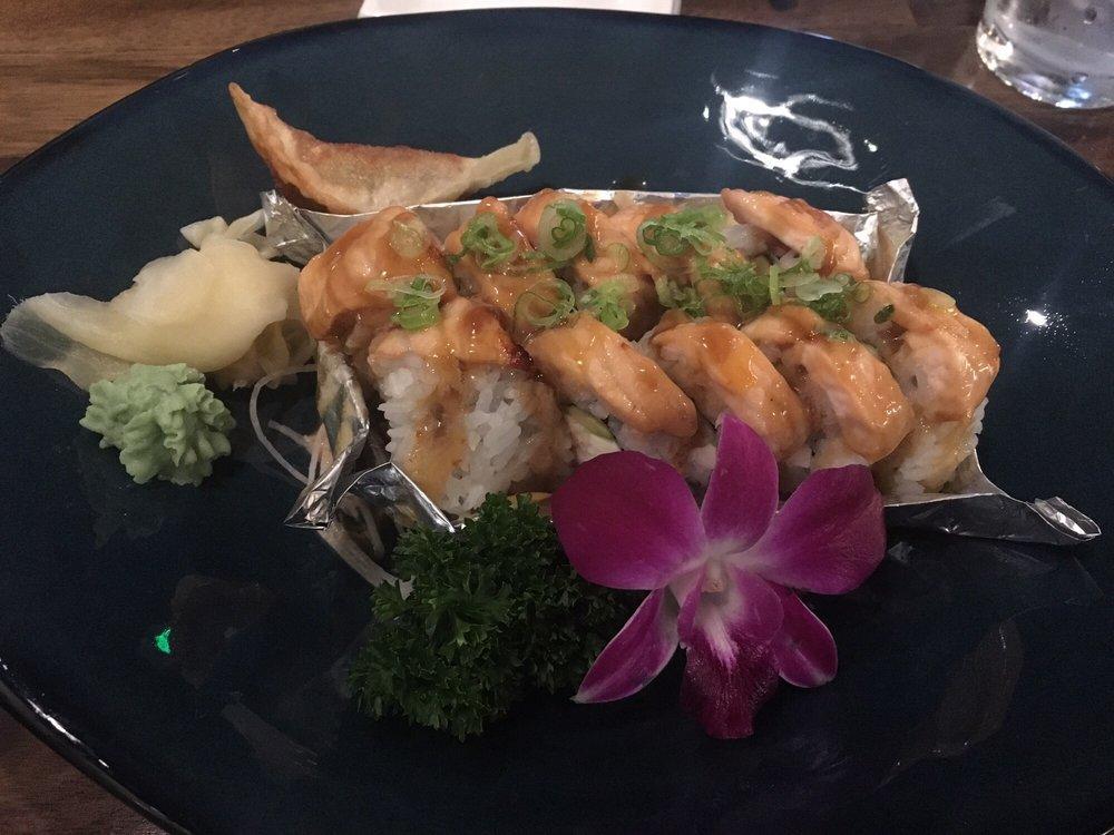 Dragon Roll · Inside shrimp tempura, avocado, and crab. Outside fresh water eel and avocado.
