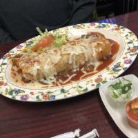 Carne Asada Wet Burrito · All meat burrito served with salsa, onion, cilantro, topped with special sauce, cheese, and ...