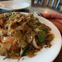 Pad Kee Mow · Minced meat. Flat noodles, egg, white onions, tomatoes, bell peppers, basil, broccoli, and j...