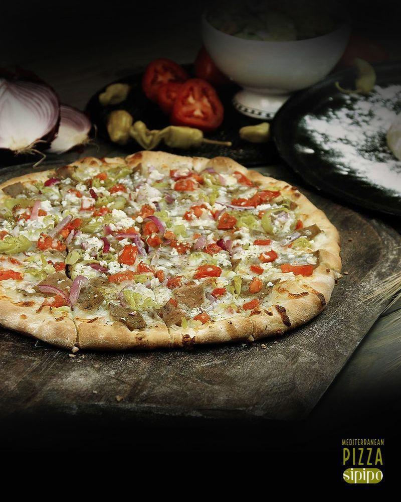 Mediterranean Pizza · Virgin olive oil, gyro meat, tomato, red onion, pepperoncini, feta cheese and mozzarella cheese.  