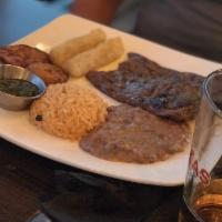 Carne Asada · Certified Angus Beef skirt steak, served with spanish rice, black beans, fried plantain, yuc...