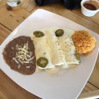 Chicken Enchiladas · Three shredded chicken enchiladas topped with warm sour cream sauce