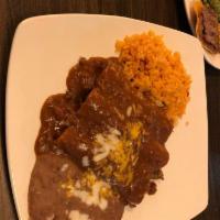 Beef Enchiladas · Three beef enchiladas topped with homemade chili con carne