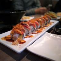 Hungry Man Roll · Shrimp tempura, cucumber, krab meat roll topped with freshwater eel, spicy tuna and spicy cr...