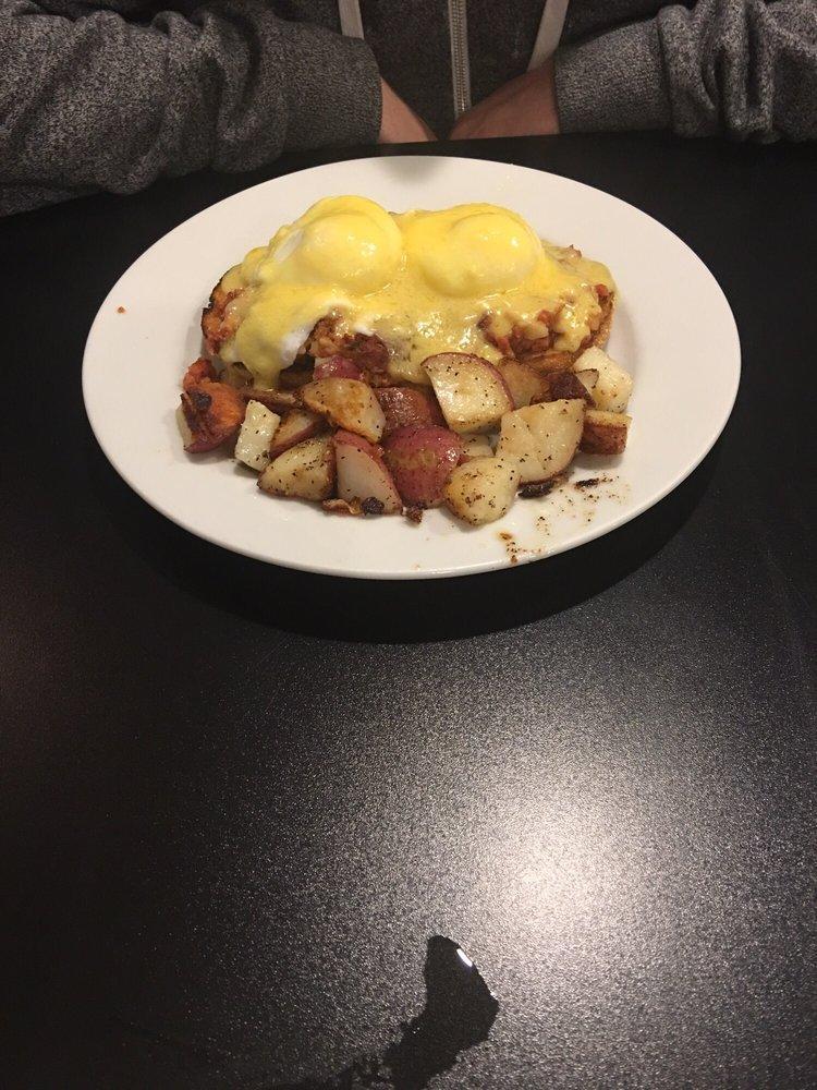 Classic Egg Benedict · 2 poached eggs, 2 slices of Canadian bacon atop of English muffins, and hollandaise sauce.