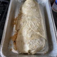 Macho Burrito · Choice of meat, re-fried beans, rice, cheese, topped with sauce, guacamole, sour cream, toma...