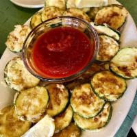 Fried Zucchini · Thin sliced zucchini, egg battered, and deep-fried. Served with dipping marinara sauce.
