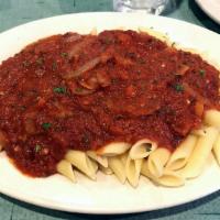 Penne Arrabiatta · Onions sauteed in a spicy marinara sauce, served over penne pasta.