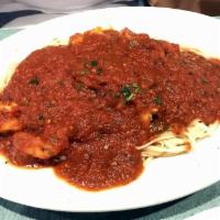 Shrimp Fra Diavolo · Shrimp sauteed in spicy marinara and white wine sauce served over pasta.