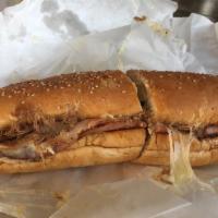 Royal Feast Sandwich · Cheese caped grilled and stacked pot roast beef, turkey, and ham complimented with hot peppe...