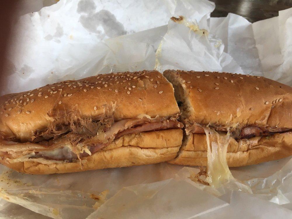 Royal Feast Sandwich · Cheese caped grilled and stacked pot roast beef, turkey, and ham complimented with hot pepper cheese, black olives, grilled onions, and our 