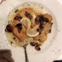 Chicken Piccata · Lightly breaded sauteed chicken with capers and mushrooms in lemon wine sauce.