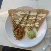 Southwest Quesadilla · Grilled. Whole wheat tortilla, cashew cheese, wild rice, black bean and corn salsa, red pepp...