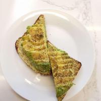 Avocado Herb Toast · Whole grain bread, avocado, basil pesto, oregano, sea salt, black pepper.