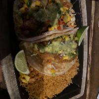 Fish Tacos · Signature flour tortillas, filled with shredded cabbage, Serrano aioli, mango salsa, avocado...