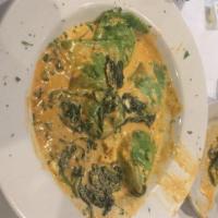 Spinach Ravioli · Formaggio ravioli stuffed with spinach and ricotta cheese and sautéed with spinach and eithe...
