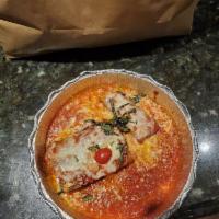 Lasagna · Freshly baked homemade lasagna layered with bolognese sauce, bechamel, shredded mozzarella, ...