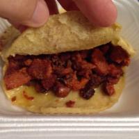 Pastor Gordita Plate · 2 corn gorditas filled with cheese & meat served with rice & beans.