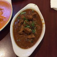 Lamb Curry · Diced lamb cooked in special gravy of, onions, ginger, garlic, and spices.