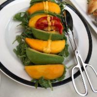 Mango Avocado Salad · Served with baby arugula and orange citrus dressing.