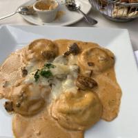 Wild Mushroom Ravioli · Sauteed mushrooms in brandy cream sauce.