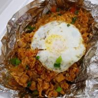 Kimchi Fried Rice · Chicken, kimchi, onions, and sunny side up egg on the top. Spicy.