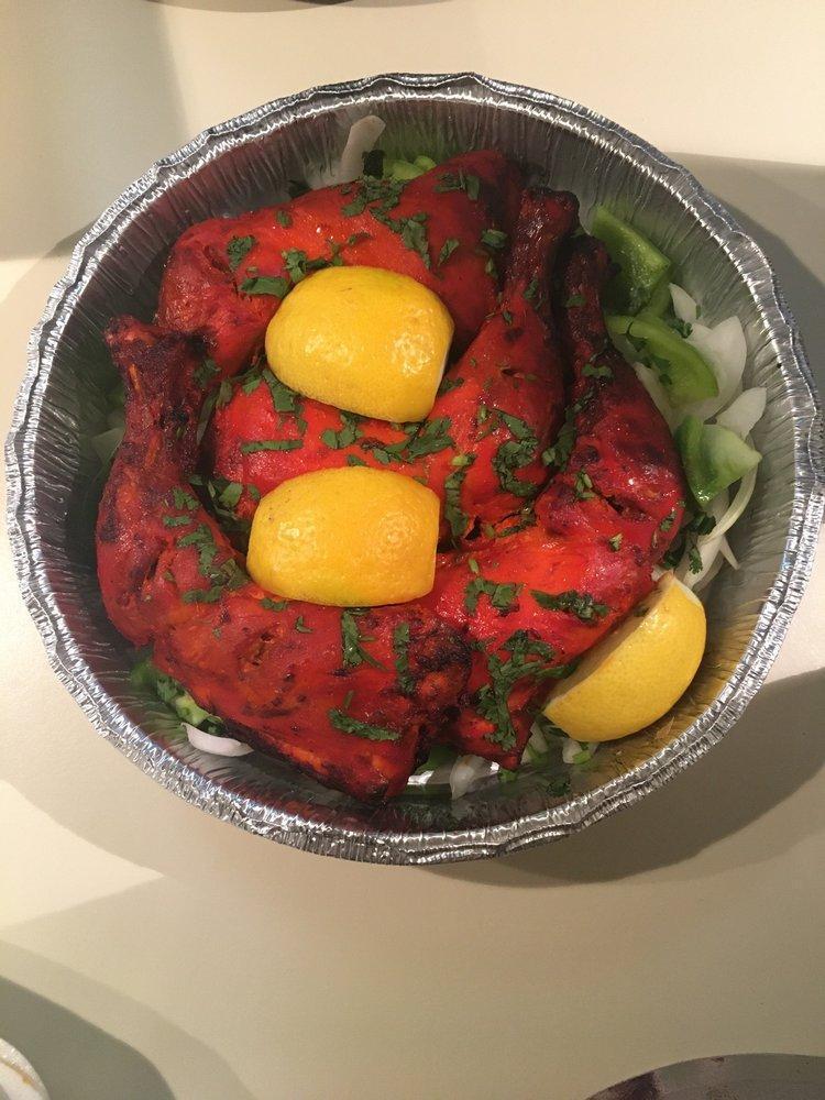 Tandoori Chicken · 3 chicken legs marinate in yogurt and spices then barbecued in our traditional clay oven.