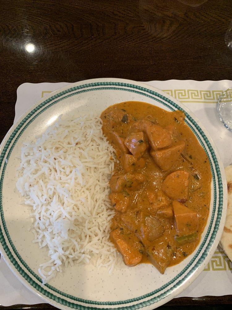 Chicken Tikka Masala · Tender boneless pieces of chicken, bell pepper, onion cooked in a hot and spicy tomato based sauce, topped with fresh Indian herbs.
