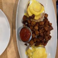 Eggs Benedict · English muffin, Canadian bacon and poached eggs. Served with diced potatoes. 