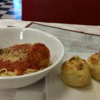 Spaghetti and Meatballs · Piled high with marinara sauce and 2 meatballs. Served with a salad and featured bread.
