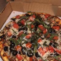 West Coast Vegan Pizza · Thin crust pizza with shaved garlic, mushrooms, tomatoes, olives, daiya vegan cheese and fre...