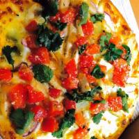 Bruschetta Chicken Pizza · Thin crust pizza with creamy garlic sauce, roasted chicken, diced onions and topped with fre...