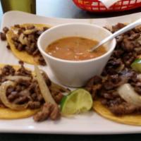 Mini Tacos · 4 corn tortillas filled with asada, pastor or chicken fajita, cilantro and onions, served wi...