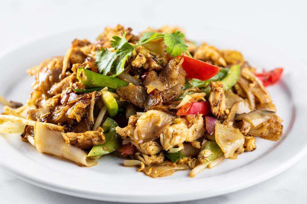 Pad Kee Mow · Stir fried flat noodle with your choice of meat, bell pepper, yellow onion, basil, tomatoes in Thai basil sauce.