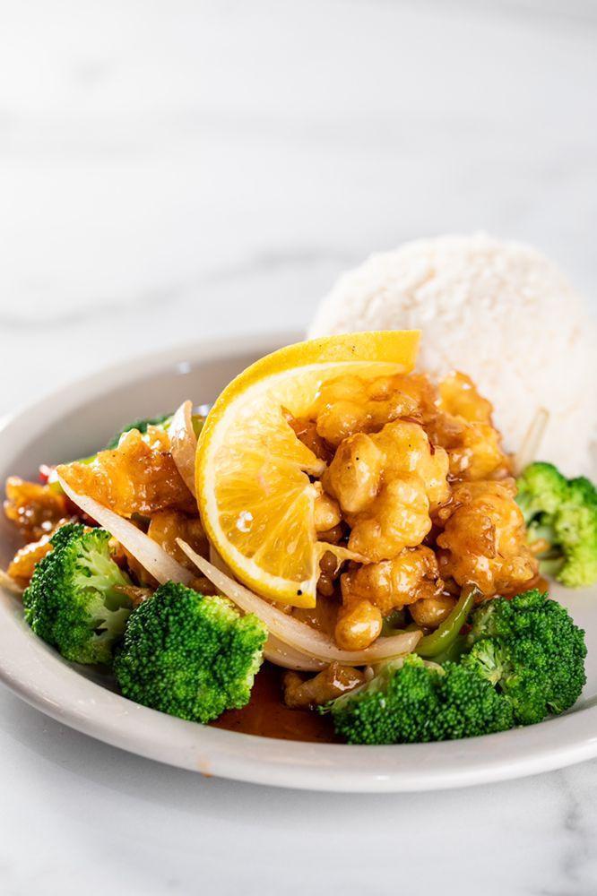 Thai Orange Chicken · Marinated fried chicken Thai style stir fried with Thai orange sauce, bell pepper served with broccoli.