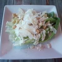 Caesar Salad · Romaine hearts with homemade Caesar dressing, toasted croutons, and shaved Parmesan.
