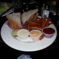 Corned Beef Sandwich · Thick cuts of our delicious corned beef topped with homemade sauerkraut, horseradish and Swi...