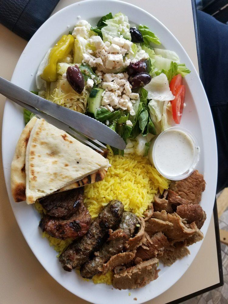 Sinbad's Mixed Grill Platter · Gyro slices, shish kabob and Kufta kabob. Served with basmati yellow rice, Greek salad, warm pita.