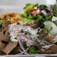 Beef Gyro Platter · Includes a small Greek salad, hummus, a bed of basmati rice and a loaf and a half of pita br...