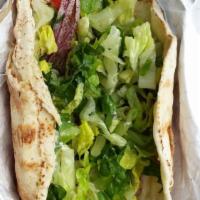 Garlic Chicken Pita Sandwich · With garlic sauce. Made with romaine lettuce, tomato, red onion and parsley. 