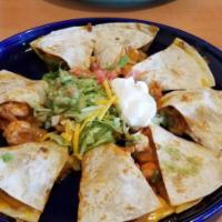 Quesadilla · Served with lettuce, tomato, sour cream and guacamole. Add meat chicken, beef or shredded be...