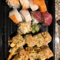 Zushi Roll · Shrimp tempura roll with seared spicy tuna on top and spicy mayo, scallion, roasted garlic w...