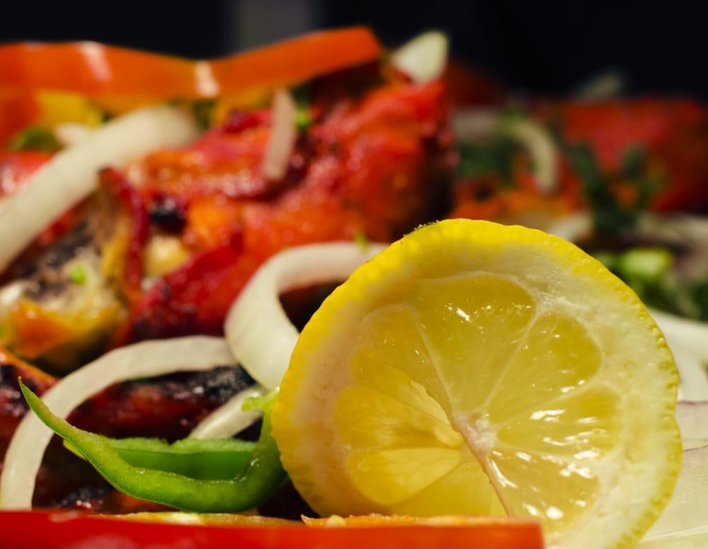 Tandoori Chicken · A barbecue delight, marinated overnight. Served with basmati rice. Served with basmati rice.