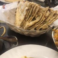 Assorted Bread Basket · Naan, garlic naan, tandoori roti and paratha.
