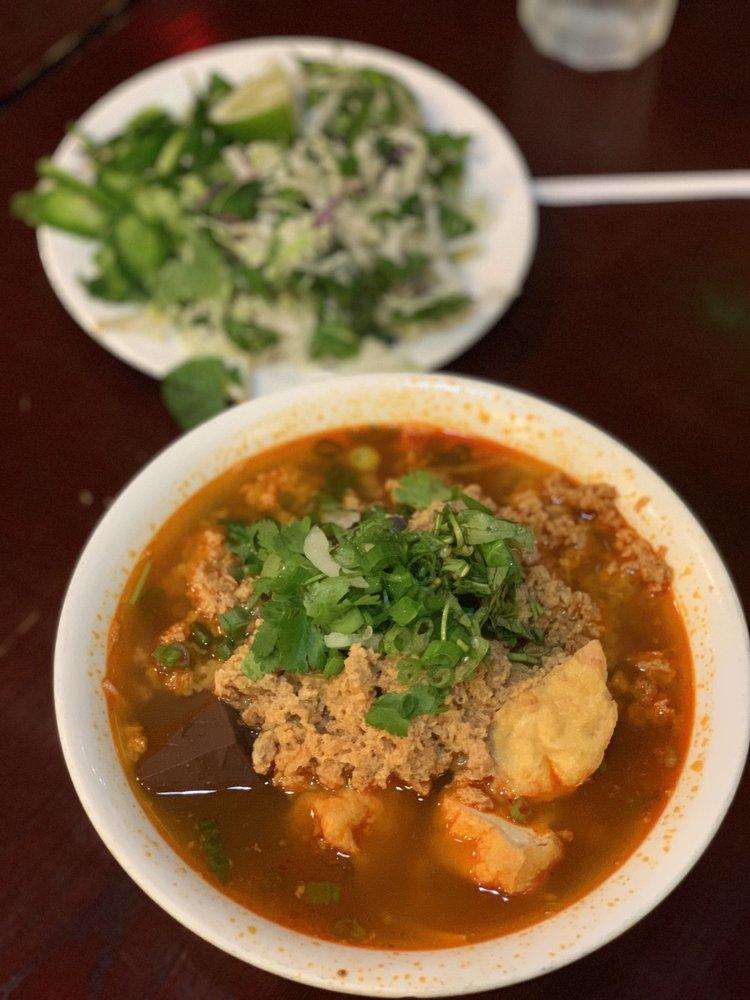 Bun Rieu · Crab paste rice noodle soup with tofu, tomato and blood cubes.