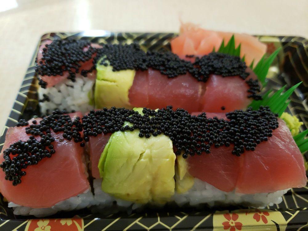 8 Piece Hungry Maki · Spicy salmon and mango, topped with tuna, avocado and tobiko.