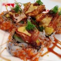 5 Piece Kiss of Fire Maki · Fried unagi, asparagus, mango topped with seared salmon, Japanese BBQ sauce a tobiko.